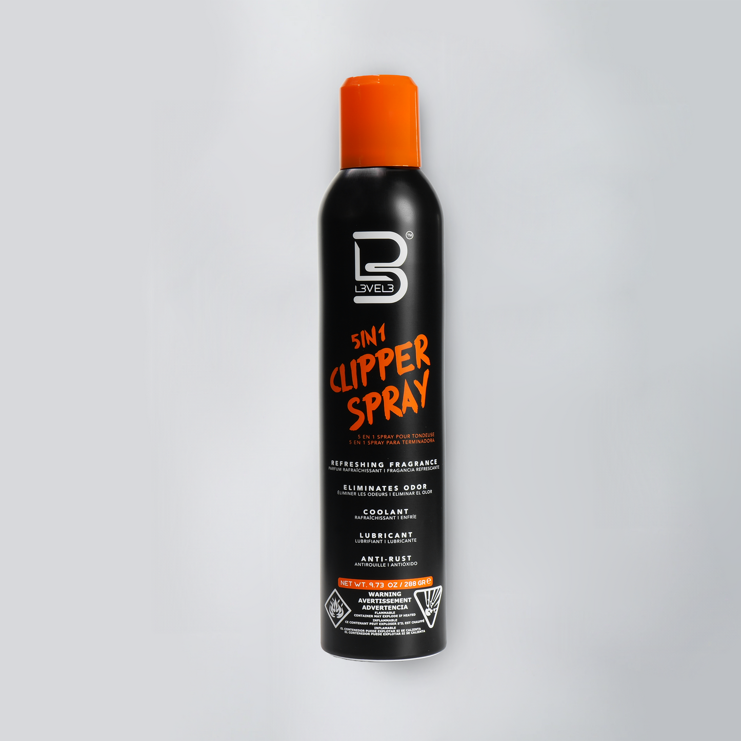 Black can of clipper spray with orange cap on a white background