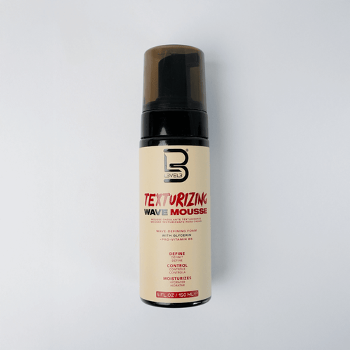 Texturizing wave mousse bottle with brand logo on a light gray background