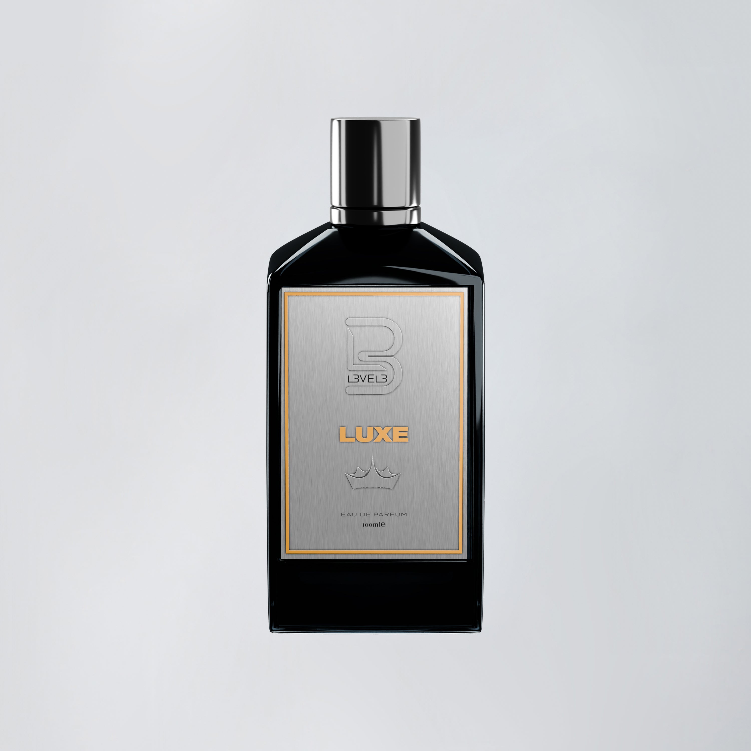 Black perfume bottle with silver cap on a light gray background