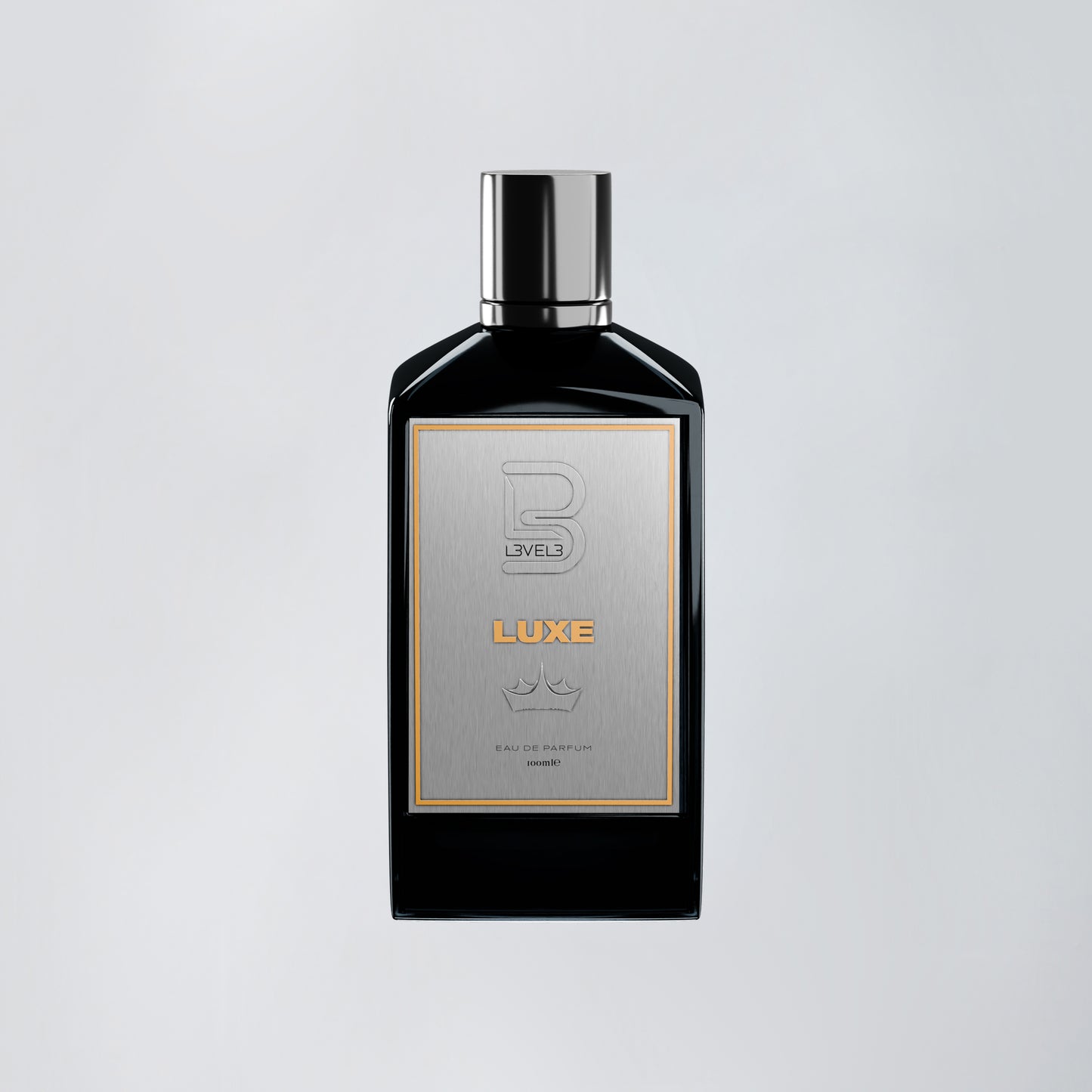 Black perfume bottle with silver cap on a light gray background